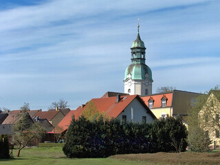 small-town settlement with a mighty baroque church tower