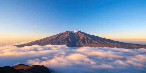 A wide-angle shot of majestic mountain peaks rising above a sea of clouds