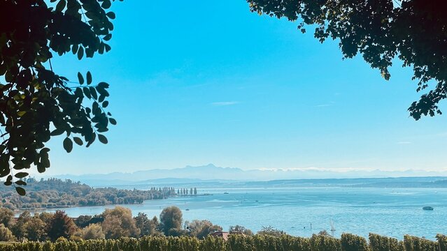 Enjoying a serene lake view under clear blue skies filled with tranquility and beauty