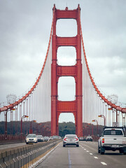 Driving along Golden Gate Bride, San Francisco, California, USA against cloudy sky from north to south