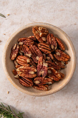Bowl of Pecans on Light Surface