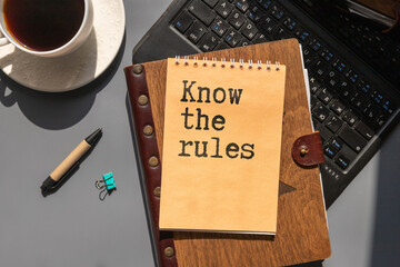Know the rules message written on ripped torn white paper