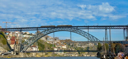 Obraz premium Porto, Portugal. Panoramic cityscape image of Porto, Portugal with the famous Luis I Bridge and the Douro River 