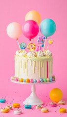 Festive birthday cake adorned with vivid candies and balloons against a pink backdrop