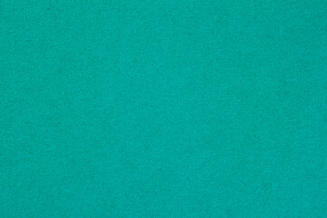 Bright turquoise backdrop with soft texture ideal for artistic design