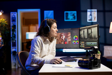 Video editor adds sound effects to filmed footage, working in post production creative studio....