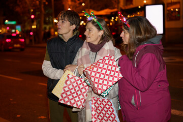 Family enjoying christmas shopping at night