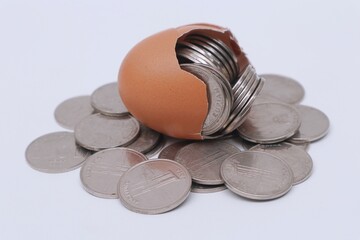 Group of coins inside an egg