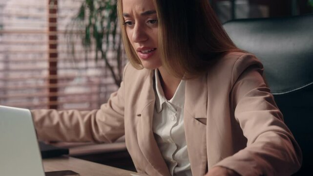 Stressed nervous multitasking Caucasian businesswoman female girl business woman office worker secretary manager typing laptop answer phone call analyzing document work overload stress deadline indoor