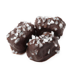 Tasty chocolate candies with salt isolated on white