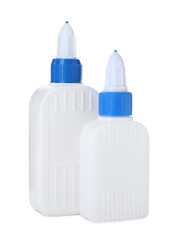 Bottles of glue with caps isolated on white