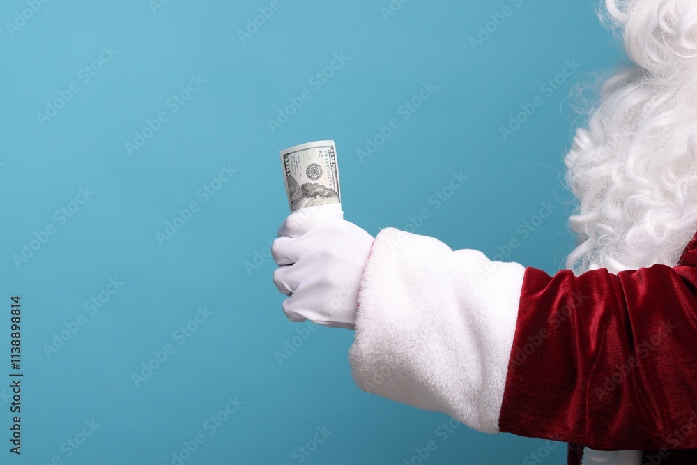 Wall mural Santa Claus with dollar banknotes on light blue background, closeup. Space for text