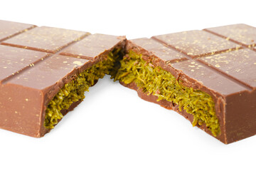 Pieces of tasty Dubai chocolate with pistachios and knafeh isolated on white