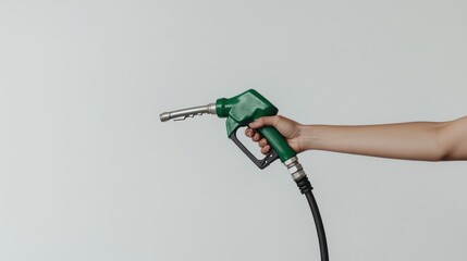 Hand holding gas pump at night, cinematic and photorealistic creating depth and focus on hand and fuel equipment