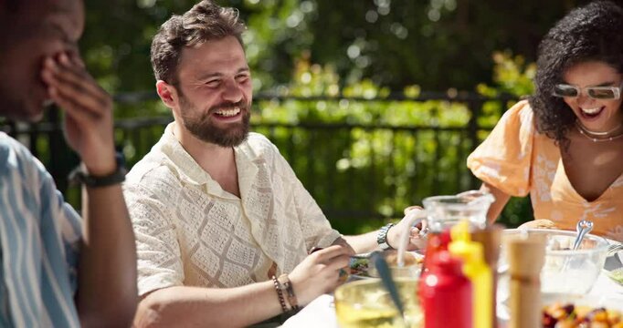 Man, friends and lunch in backyard with laughing, drinks and happy with new years event. People, girl and group at barbecue with funny memory, smile and relax with food at reunion party in sunshine