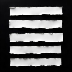 Ripped white paper strips against a black background