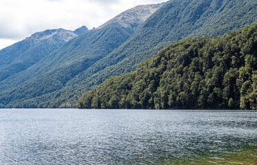 Lake manapouri te anau new zealand beautiful landscape fiordland national park hills mountains lush