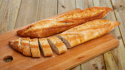 Fresh bread on a wooden cutting board. High quality photo
