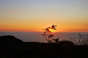 sunrise on the mountain overlooking the ocean