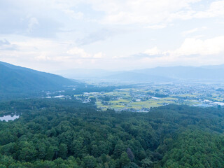 Aerial photo overlooking the city from the top of a mountain in Komagane City, Nagano Prefecture, Japan