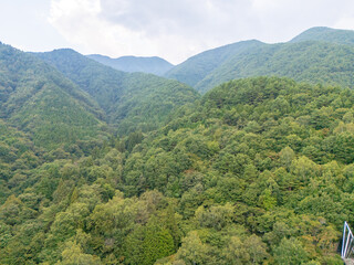 Aerial photo overlooking the city from the top of a mountain in Komagane City, Nagano Prefecture, Japan