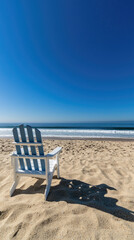 Relaxing beach chair on sandy shore with ocean view