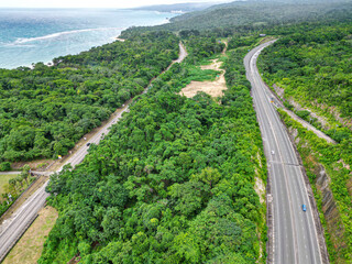 North South tool road highway St Catherine Kingston to Mammee Bay St Ann Ocho Rios Montego Bay North Coast Jamaica with lush greenery and Caribbean sea
