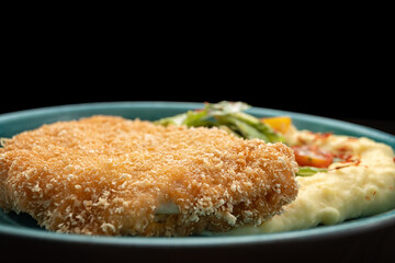 Chicken schnitzel stuffed with cheddar cheese