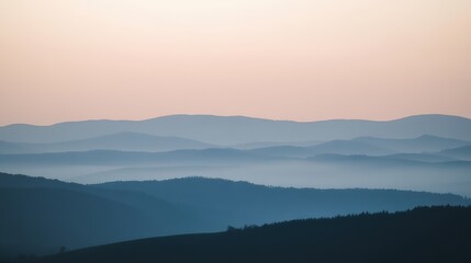 Serene Sunrise Over Rolling Hills with Soft Misty Landscape View