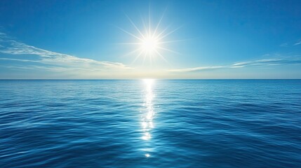 Rays of sunlight piercing through clear blue ocean water for serene aquatic and nature-focused designs.