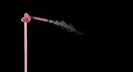 Plastic bio degradable straws with mist shooting from straws creating unique patterns