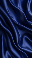 Fototapeta premium Background,shot of silk fabric, surface with soft reflections, deep blue color, smooth flowing folds