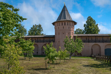 View of the walls and tower of the Spaso-Evfimiev Monastery on a sunny summer day, Suzdal, Vladimir region, Russia