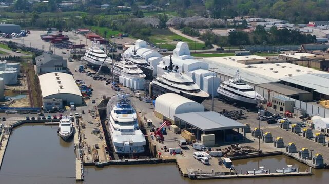 Production shipyard with deep sea luxury yachts under construction. Assembly and service of sea vessels in Savannah, Georgia, USA.
