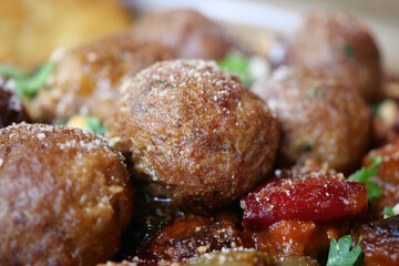 Delicious and Savory Meatballs Served Alongside Colorful Fresh Vegetables