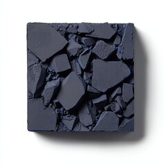 A textured, dark-colored square surface composed of various broken fragments, showcasing an abstract design with a rough, uneven appearance.