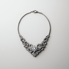 Obraz premium A beautifully crafted silver necklace featuring intricate floral designs and sparkling accents, perfect for elegant occasions.