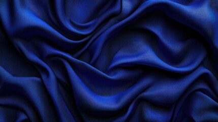 Obraz premium Luxurious deep blue silk fabric with elegant folds and drapes.