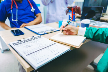 Three doctors meet at a table in a hospital to discuss heart and liver diseases, collaborate on treatment plans, and decide on the best medications for their patients' care