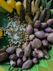 Traditional healthy snacks menu for parties in Indonesia, there are sweet corn, stewed peanuts, potatoes, bananas and breadfruit fresh from steamer.