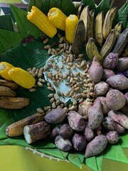 Traditional healthy snacks menu for parties in Indonesia, there are sweet corn, stewed peanuts, potatoes, bananas and breadfruit fresh from steamer.