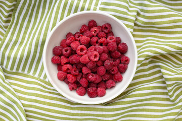 Fresh raspberry in a white bowl