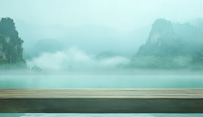 Misty mountain lake scene with wooden platform.