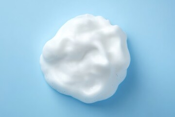 White foam blob on a light blue background