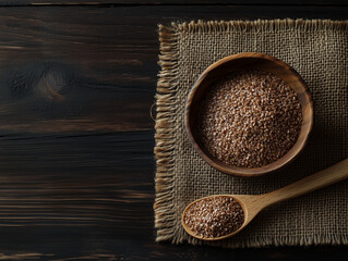 flaxseed in wooden bowl with wooden spoon burlap placemat