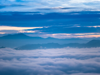 Fototapeta premium Aiyerweng sea of mist with the mountains during sunrise time in the south of Thailand, Aiyerweng, Betong district, Yala province, Thailand.