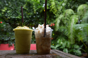 Avocado Milk Shake, Drink smoothies in the garden, Refreshing fruit and avocado smoothies surrounded by vibrant ingredients outdoors
