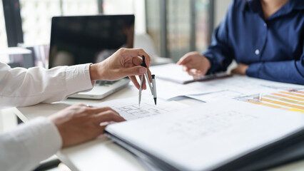 Architecture drawing on architectural project business architecture building construction Colleagues designer Planning Design on blueprint and compasses