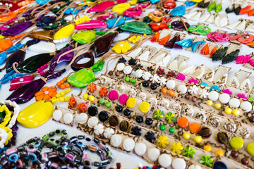 A table full of colorful beads and beads of different shapes and sizes