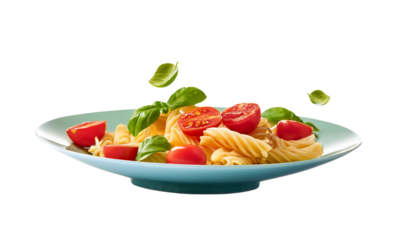 Fresh pasta with tomatoes and basil on a blue plate, white isolate background.